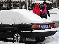 Пекин накрыло весенним снегопадом. Фото: http://www.pravda.ru