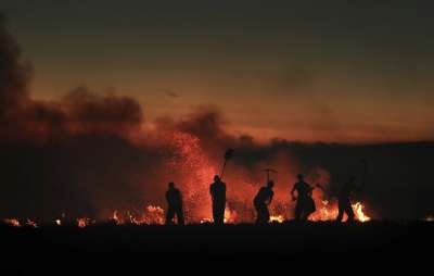 Из-за пожаров в атмосферу попадает углекислый газ, который способствует глобальному потеплению, сказала представитель Всемирной метеорологической организации Клэр Нюллис © Danny Lawson/PA via AP